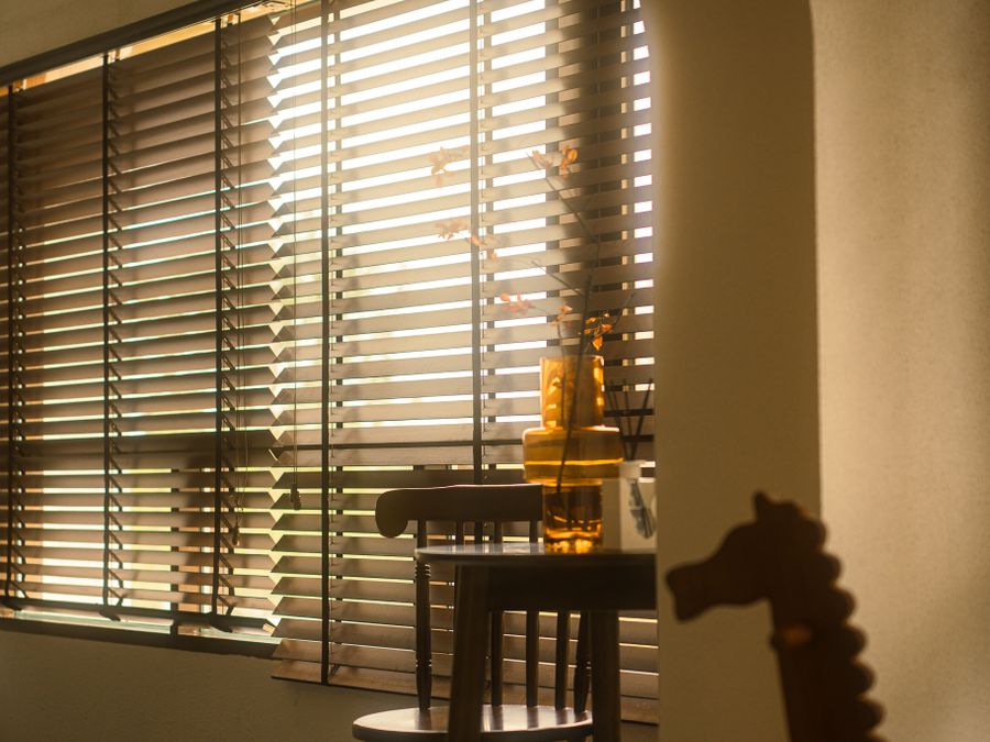 Wood-look blinds with warm afternoon light